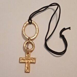 #768.  Large Textured Gold Toned Articulated Cross Pendant Necklace. 11" Long